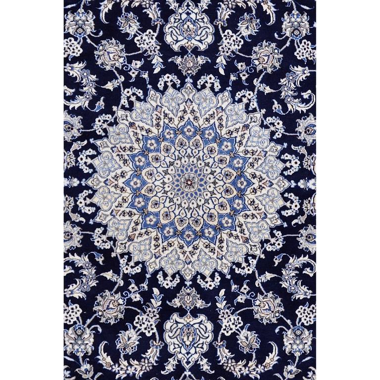 A carpet, Nain, part silk, ca 350 x 250 cm.