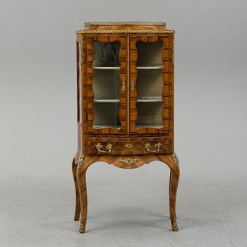 A late 19th century rococo style cabinet.