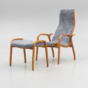 Yngve Ekström, a "Lamino" armchair with ottoman, Swedese, Sweden, 2014.