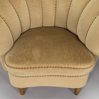 A pair of mid-20th century armchairs.