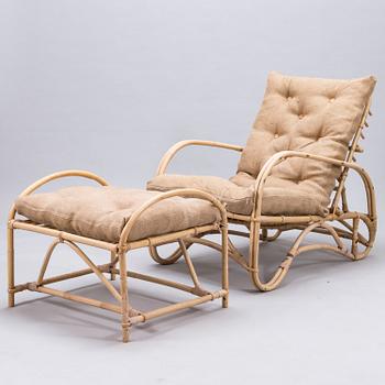 A rattan easy chair with stool, latter half of the 20th century.