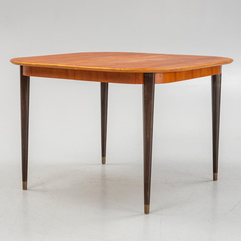 A teak-veneered dining table, mid 20th century.