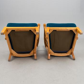 A pair of mid 20th century '2402 Armi' armchairs by Ilmari Lappalainen/Olavi Lieto, Asko, Finland.