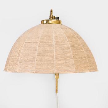 A mid-20th century wall light for Valinte, Finland.