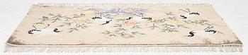 A silke figural rug, China, later part of the 20th century, ca. 92 x 170 cm.