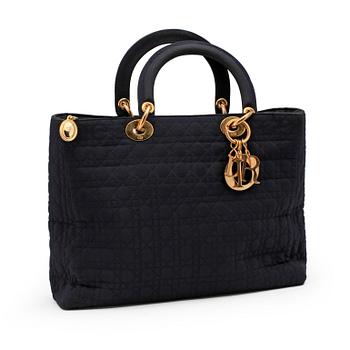 CHRSITIAN DIOR, a dark blue handbag.