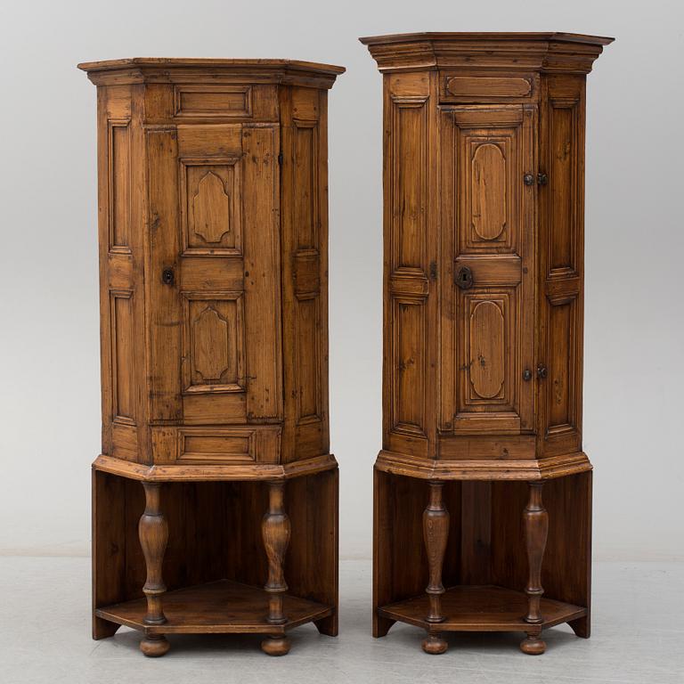 Two 18th century wooden corner cabinets.