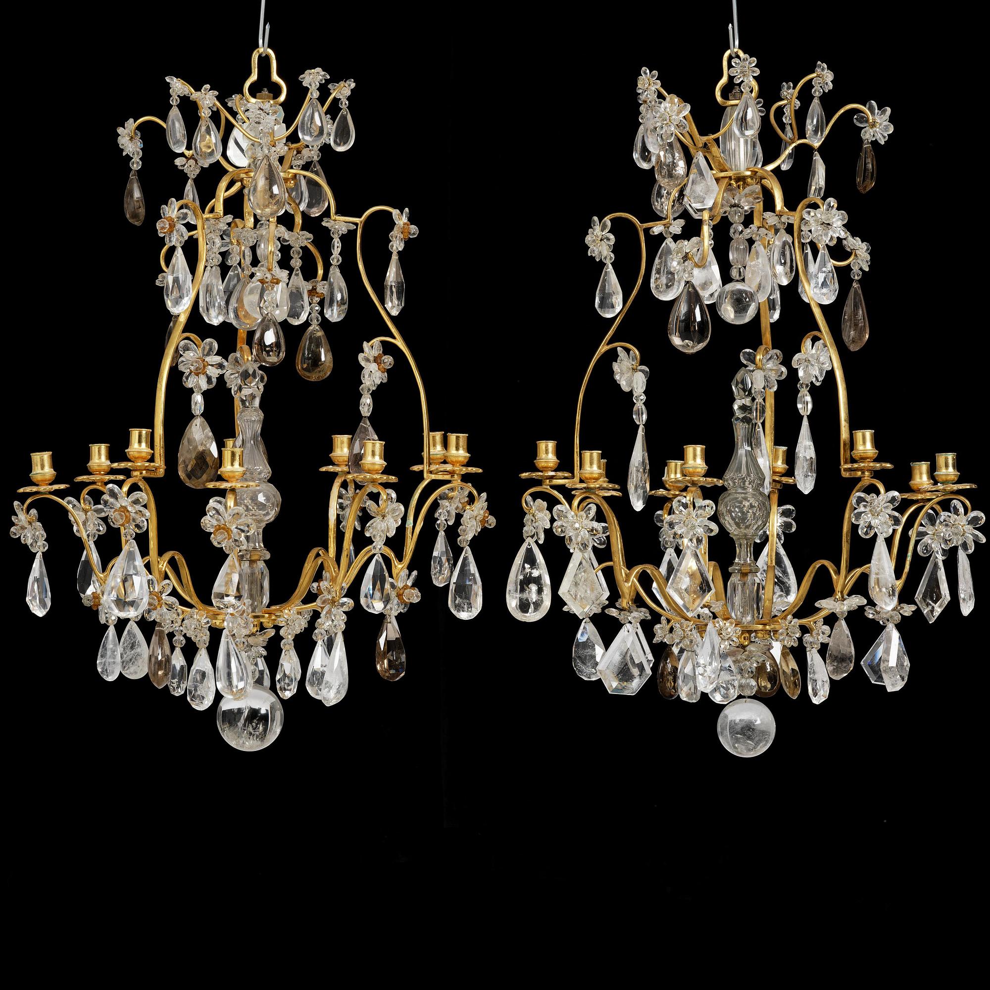 A near pair of Franch Louis-XV-style nine-branch gilt bronze and rock crystal chandeliers, later part 19th century.