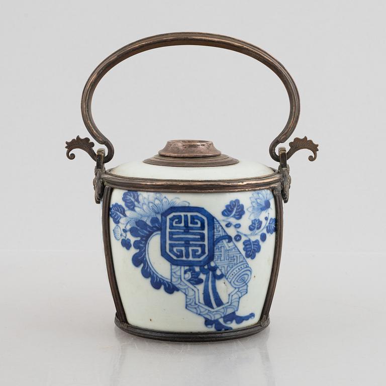 A metal mounted porcelain ewer, late Qing dynasty.