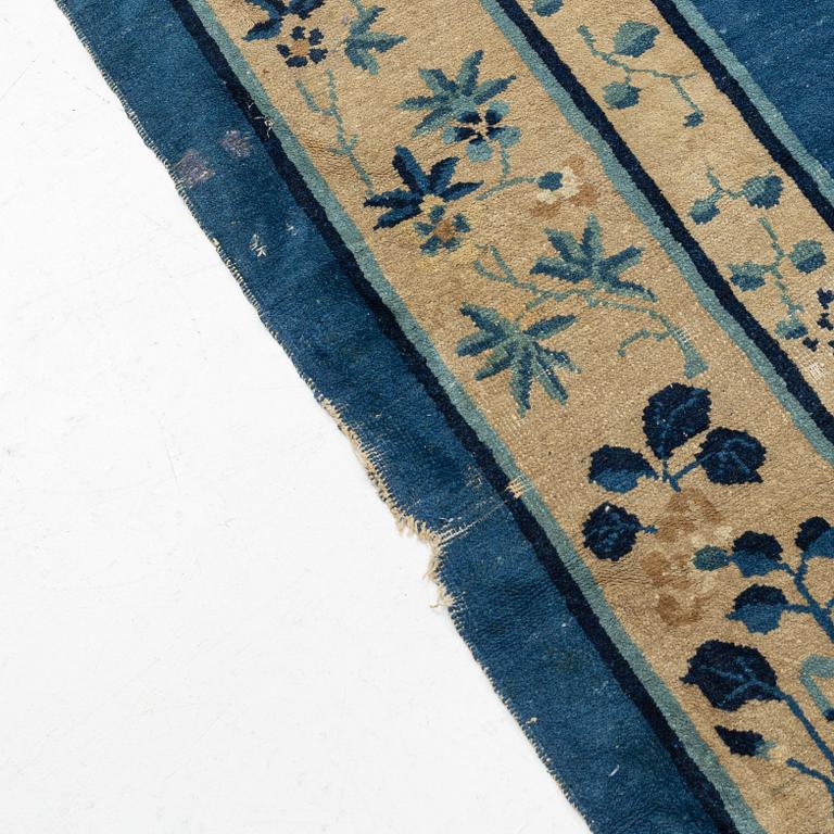 An antique Chinese carpet, c. 355 x 270 cm.