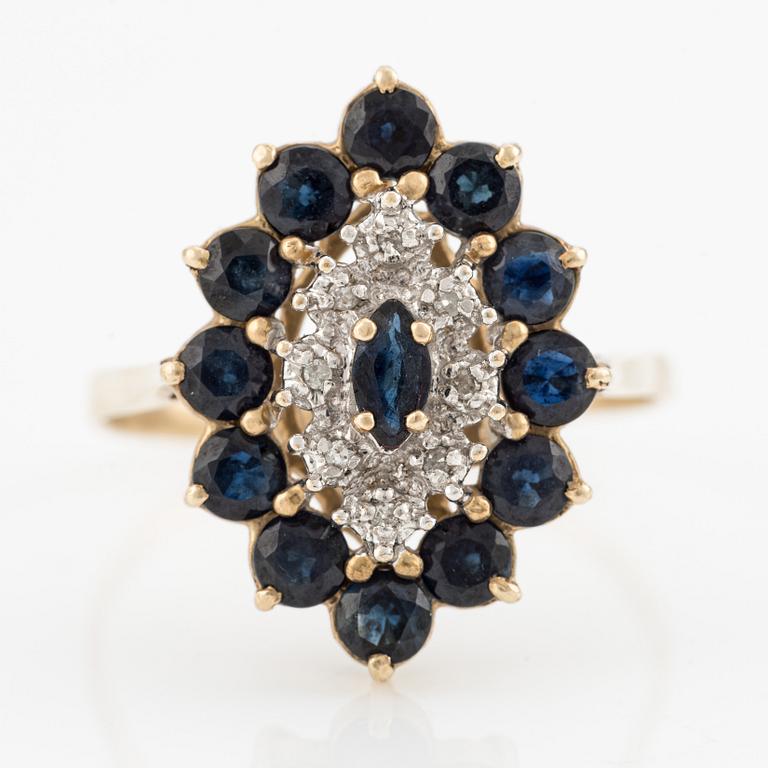 Ring 14K barn-shaped with dark sapphires and small diamonds.