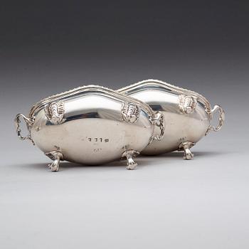 A pair of English 18th century silver sauce-tureens, marks of Sebastian & James Crespell, London 1772.