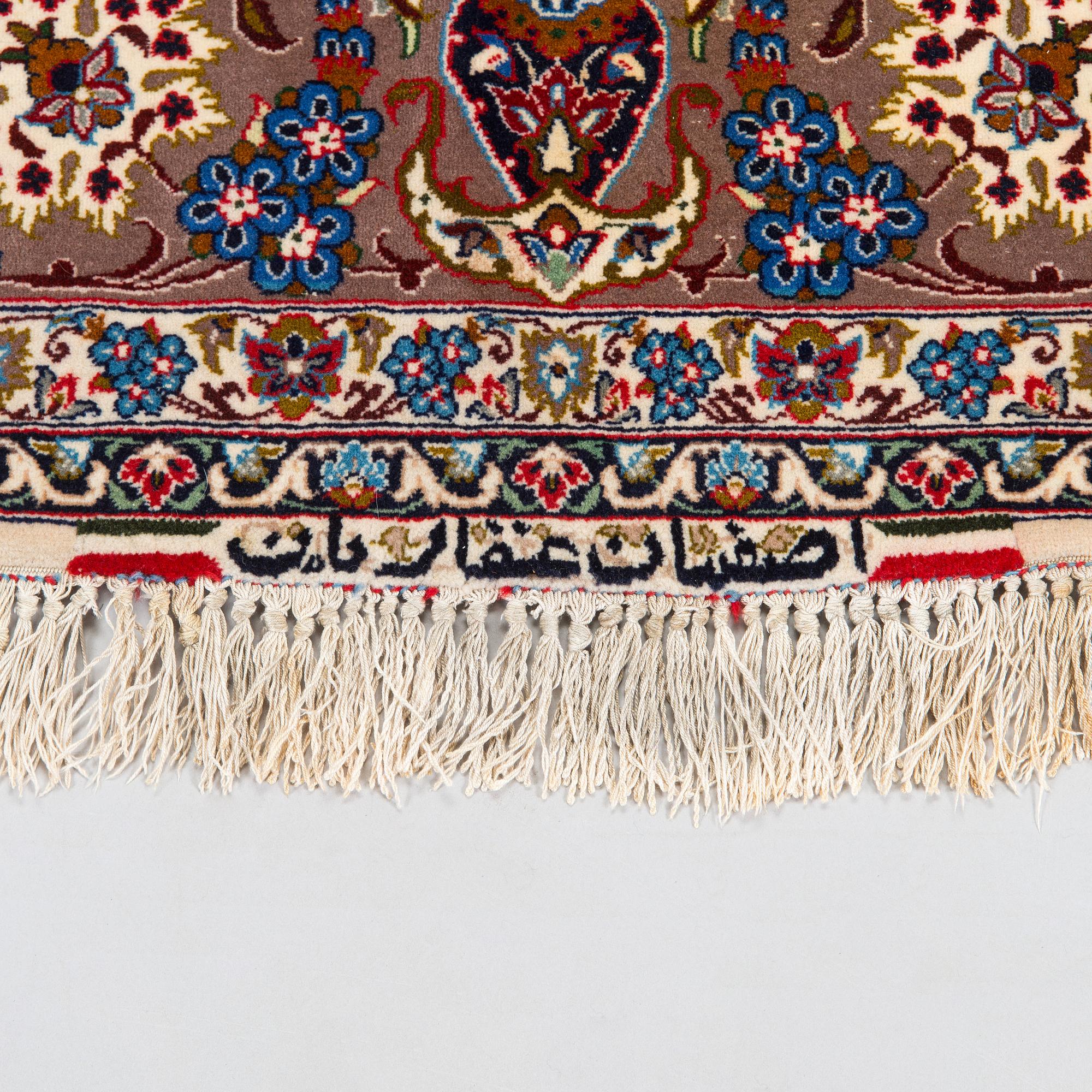 A semi-antique Isfahan rug, central Persia, signed c. 238 x 165 cm.
