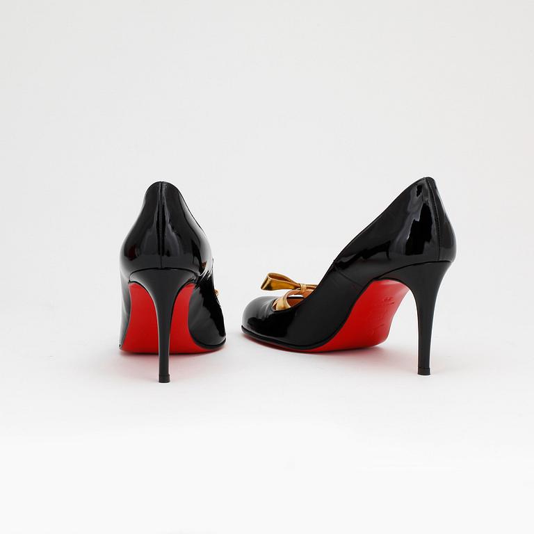 CHRISTIAN LOUBOUTAIN, a pair of black patent pumps, size 39.