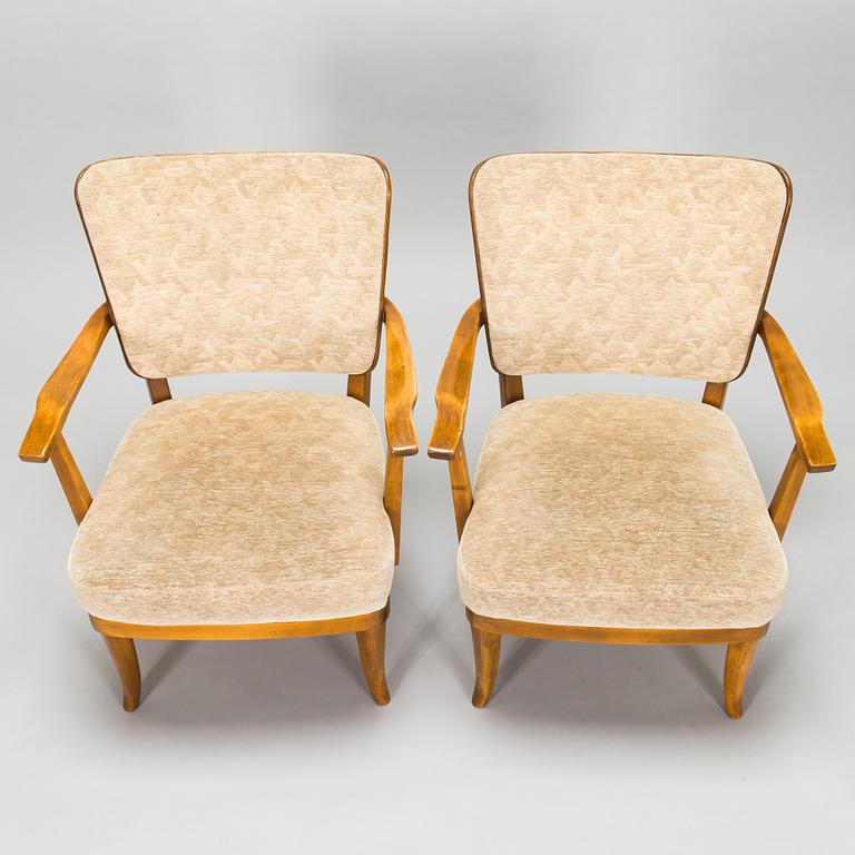 Einari Kyöstilä, a pair of 1940s open armchairs for Oy Stockmann Ab, Keravan Puusepäntehdas, Finland.