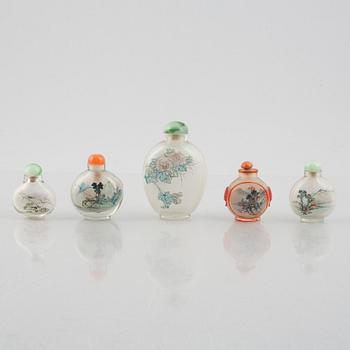A group of nine Chinese glass and porcelain snuffbottles, 20th century.