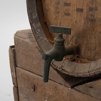 A pair of oak wine casks on stands, early 20th century.