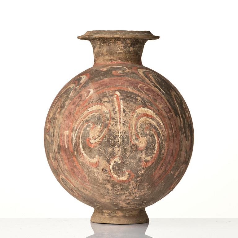 A well-painted dark grey pottery cocoon jar, 
Han dynasty (206 BC-AD 220).