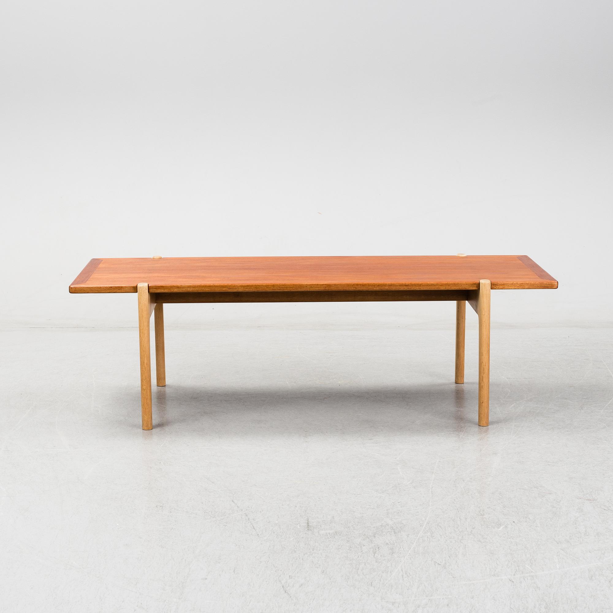A model JH 575 coffee table by Hans J Wegner for Johannes Hansen.