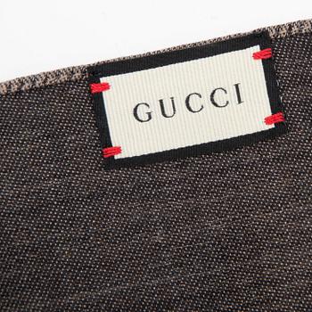 Gucci, a wool and silk mix 'GG' jaquard shawl.