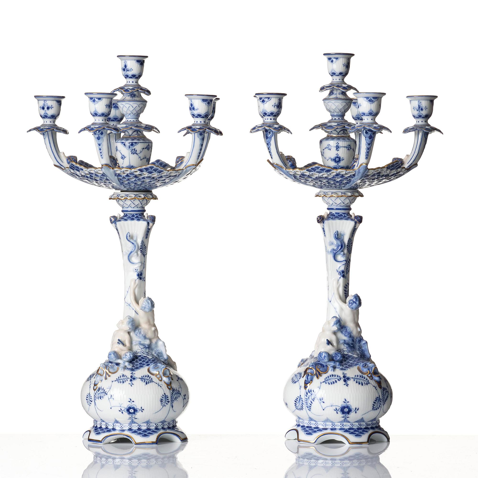 A pair of Royal Copenhagen 'Musselmalet' / 'blue fluted full lace' six-light candelabras, Denmark, 1898-1923.