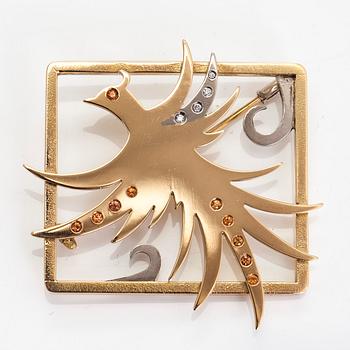 An 18K gold/white gold brooch, with diamonds and sapphires. Atelier R. Nieminen, Helsinki.