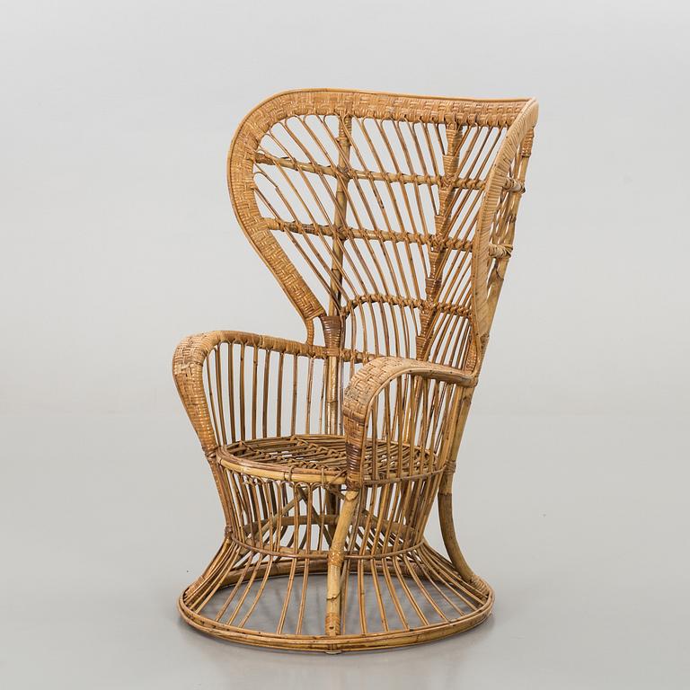 A RATTAN ARMCHAIR.