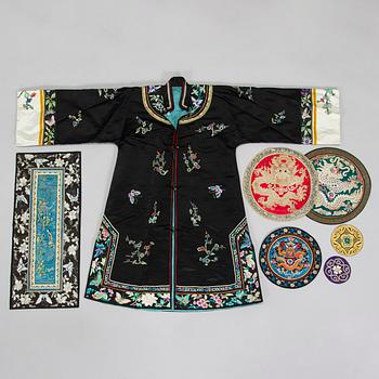 A Chinese embroidered silk robe and a buzi and five other silk embroideries, early 20th century.