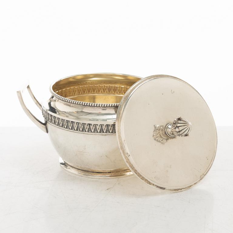 A silver coffee pot, creamer and sugar bowl, import marks of Axel Larson, Helsingborg 1920.