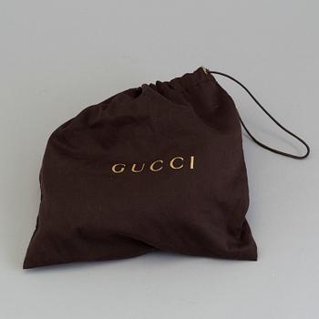 A bag SOHO, Gucci.