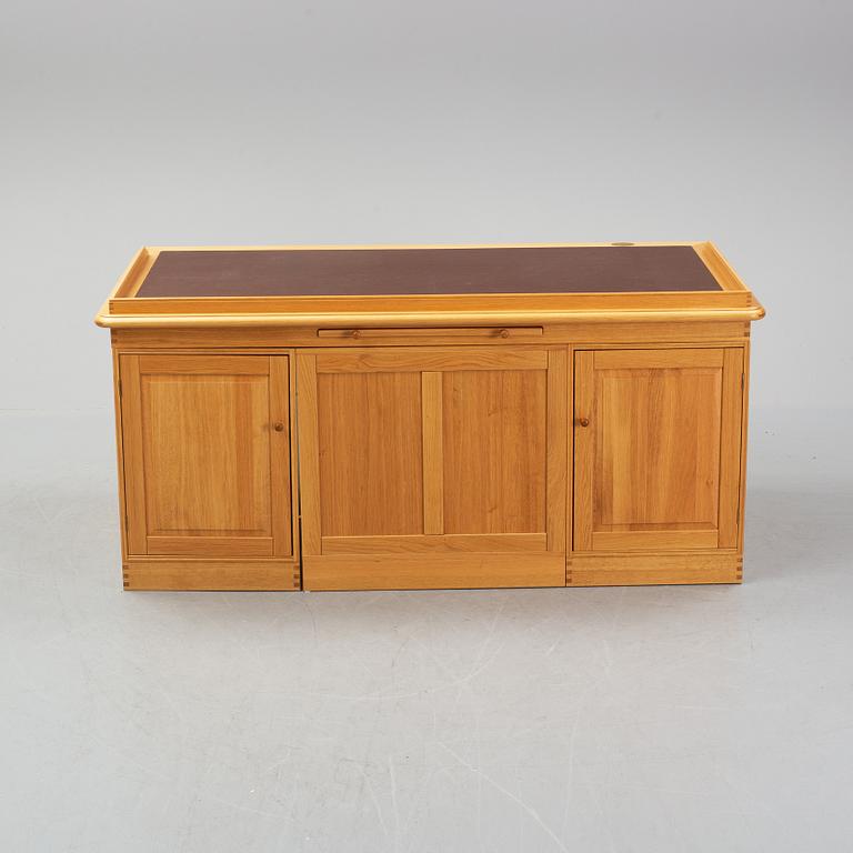 An oak writing desk by Finn N Hansen. End of the 20th Century.