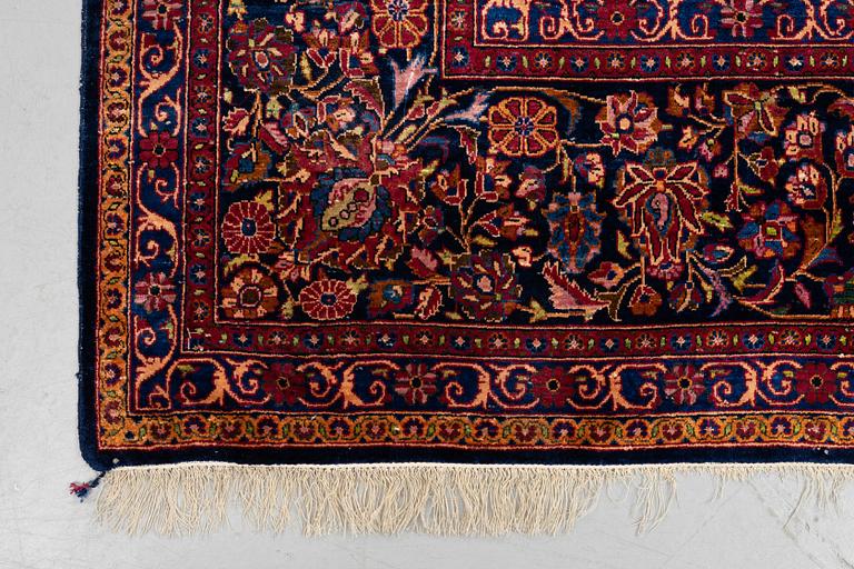 A carpet, semi-antique/old silk Kashan, ca 318,5 x 213,5 cm.