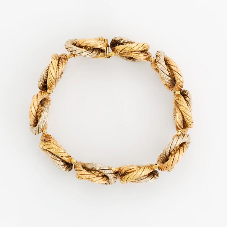 An 18K gold bracelet.