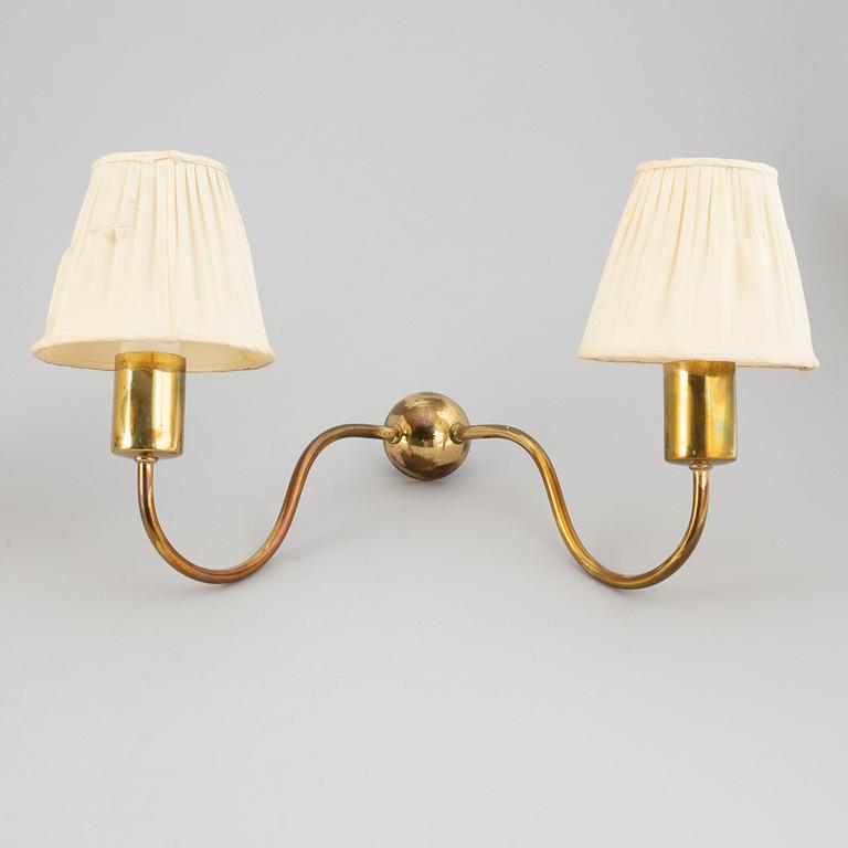 Three brass wall lamps, model 2335 and 2334, by Josef Frank, Firma Svenskt Tenn.