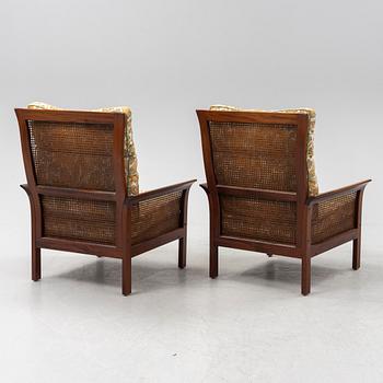 Arne Norell, a pair of 'Rotang' easy chairs, Norell Möbel AB, Sweden.