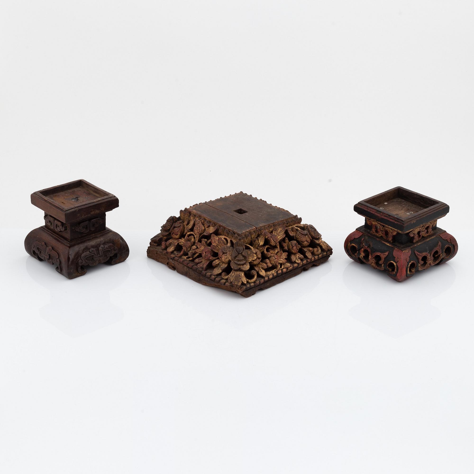 A set of three carved wooden stands, early 20th Century.