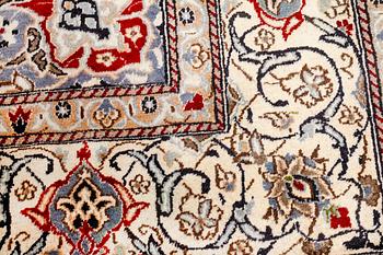 A CARPET, Nain, part silk, around 340 x 241 cm.