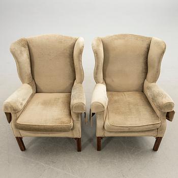 Ear flap armchairs, a pair, England, second half of the 20th century.