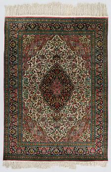 A silk Qum rug, central Persia, c. 205 x 145 cm.