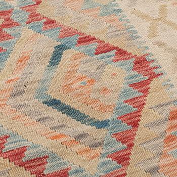 A kilim runner, around 300 x 85 cm.