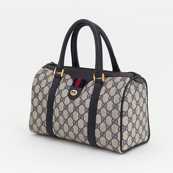 Gucci, a monogram canvas bag.