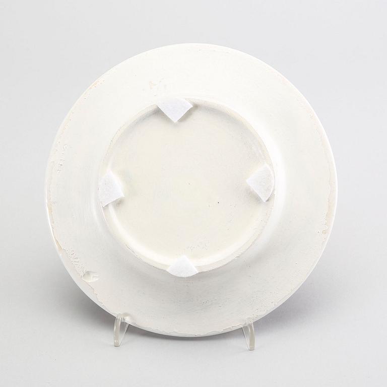 A st of three Piero Fornasetti porcelain plates.