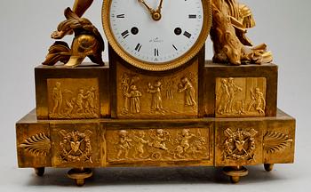 A French Empire early 19th century gilt bronze mantel clock.