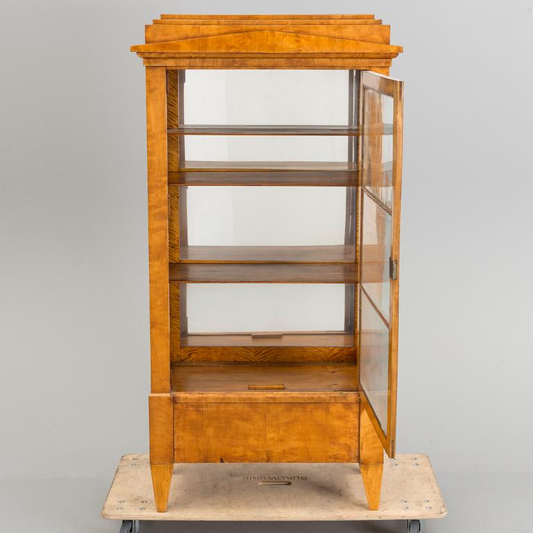 A Swedish first half of the 19th century display cabinet veneered with birch.