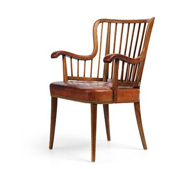 Otto Schulz, a Swedish Modern stained beech and cognac coloured leather armchair.