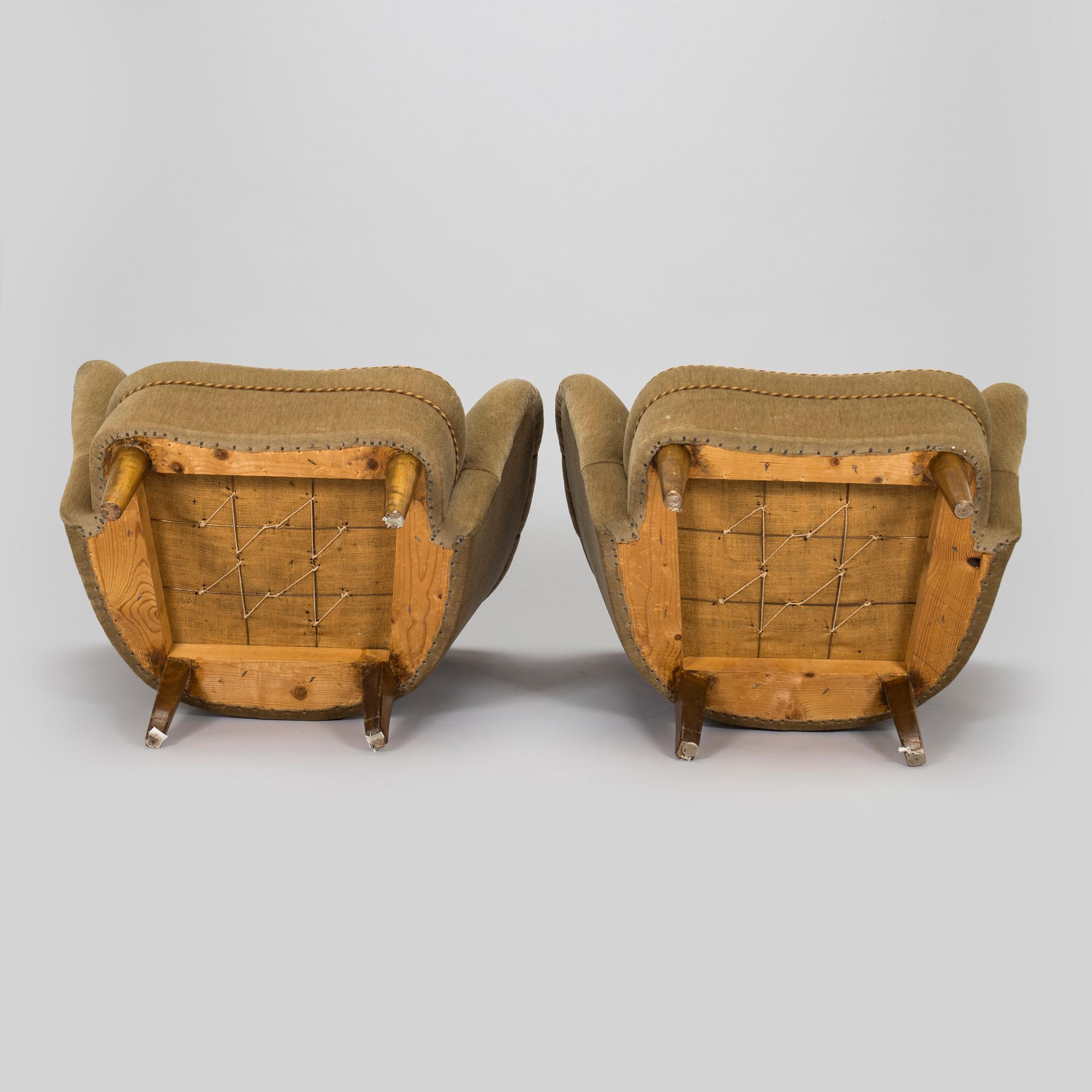 A pair of mid-20th century armchairs.