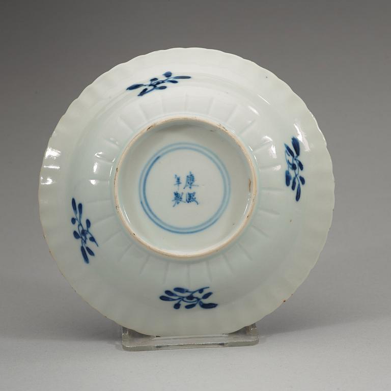 A set of six blue and white small lotus dishes, Qing dynasty with Kangxis four character mark (1662-1722).