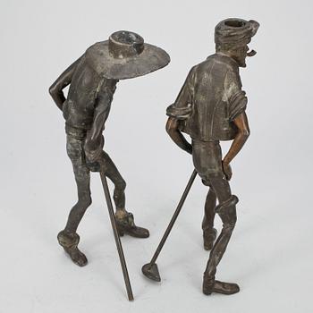 SKULPTUR/LJUSSTAKE, 2 st, patinerad metall, 1800/1900-tal.