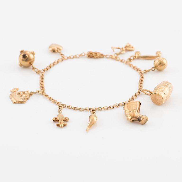 Bracelet, 18K gold with charms.