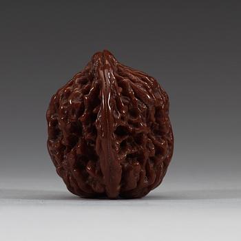 Two pairs of carved walnut hand exercisers, late Qing dynasty (1644-1912).